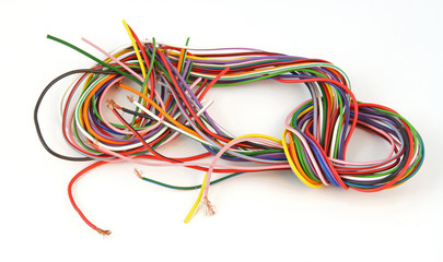 Close up of multicoloured wire on a white background.