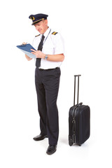Airline pilot filling in papers © Monika Wisniewska