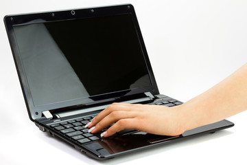 Female hands wrighting on laptop
