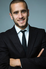 Close-up portrait of a smiling handsome young business man