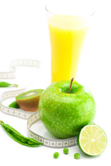 juice,apple,lime,peas,kiwi and measure tape isolated on white