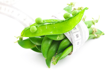 peas and measure tape isolated on white