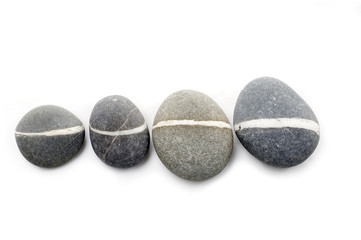 Four smooth stones arranged to a line