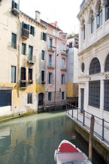 Fototapeta na wymiar canal scene with boat Venice Italy