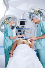 Patient being operated by the surgeons