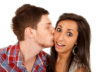woman kisses her boyfriend on the cheek