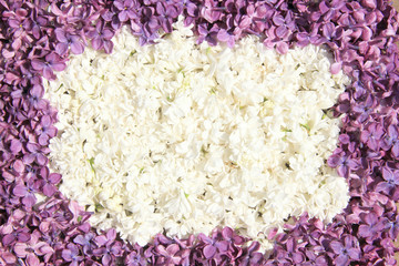 Oval beautiful frame of white and dark lilac flowers