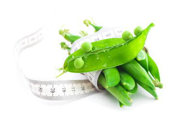 peas and measure tape isolated on white