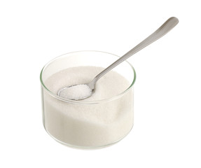 White sugar in glass bowl with teaspoon