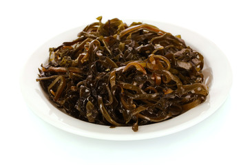 Sliced laminaria on plate isolated on the white background