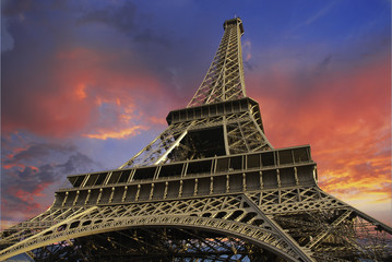 Eiffel Tower at Sunset against a Cloudy Sky