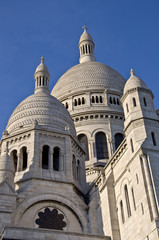 Fototapeta na wymiar Basilica of Sacre Coeur in Paris. Against the blue sky.