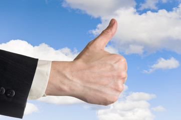 Thumb up and the blue sky