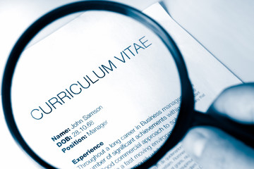 magnifying glass and cv