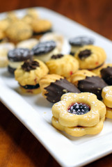 Selection of petit fours on white plate.