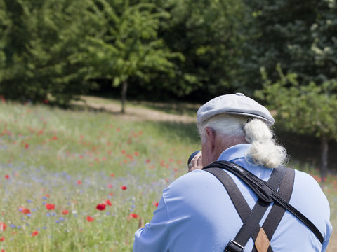 Photographer shooting poppies and blueberries