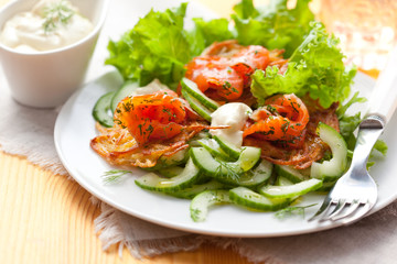 Potato rosti with smoked salmon and cucumber salad