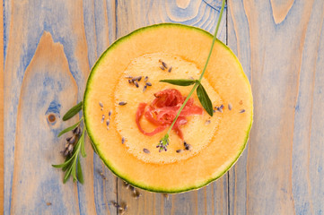 fresh melon soup with parma ham and lavender flower