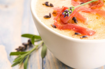 fresh melon soup with parma ham and lavender flower
