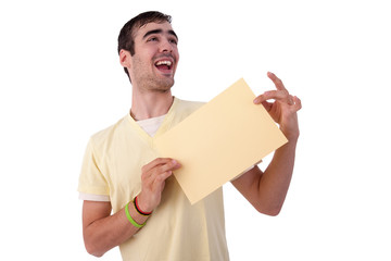 young smiling man holding a yelow sheet of paper in his hand