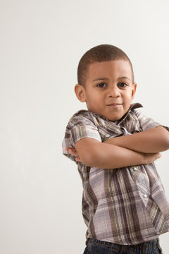 Young little boy in checkered shirt and jeans