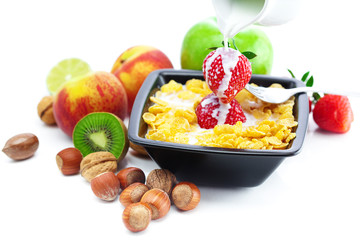 strawberry, peach, nuts,apple, kiwi, milk and flakes in a bowl i