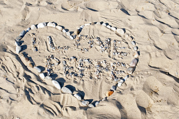 I love you, a heart signed in the sand at beach