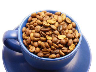 Coffee grains in a blue cup on a white background