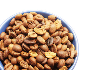 Coffee grains in a blue cup