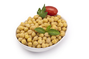 Close up view of chickpea in bowl on white background