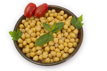 Close up view of chickpea in bowl on white background