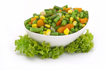 diced vegetables background with carrot, corn and peas.