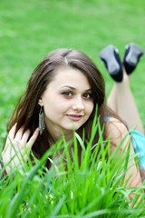 Pretty young girl relaxing on the lawn