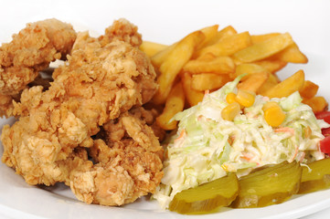 Breaded chicken with pickles , fries and salad