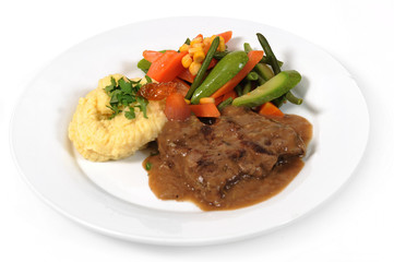 Grilled steaks, mashed potato and vegetable salad
