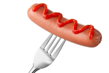 Sausage on fork with ketchup topping