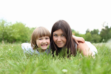 itlle girl with her mother outdoors