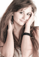 Fototapeta premium Sensual young woman with beautiful long brown hairs