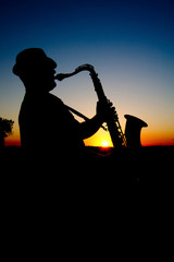 Saxophonist at sunset 2