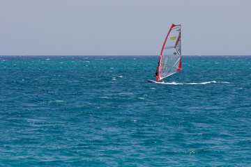 A woman windsurfing on Red Sea