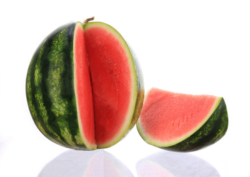 Close-up of melon over white background