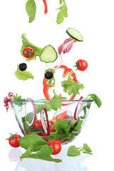 Fresh salad with vegetable in motion.