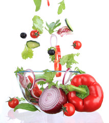 Fresh salad with vegetable in motion.