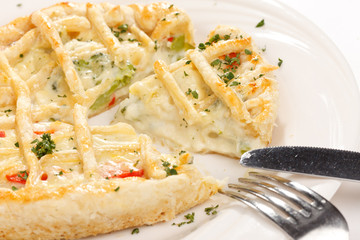 tasty quiche with cheese and herbs