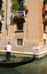 Fototapeta na wymiar gondolier on canal Venice Italy