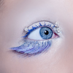 Blue eye macro closeup winter makeup jewels diamonds