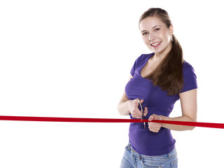 young woman is cutting red ribbon for opening