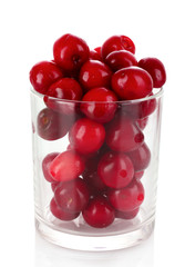 cherry in a glass container isolated on white