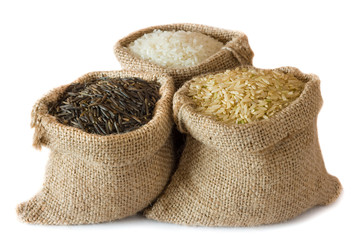 Uncooked rice in small burlap sacks