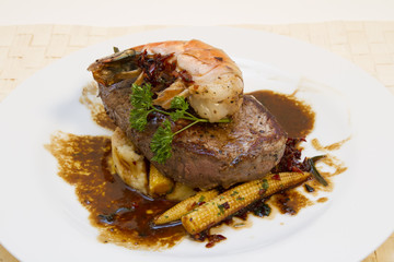 Filet of charolais beef with prawns, corn on the cob